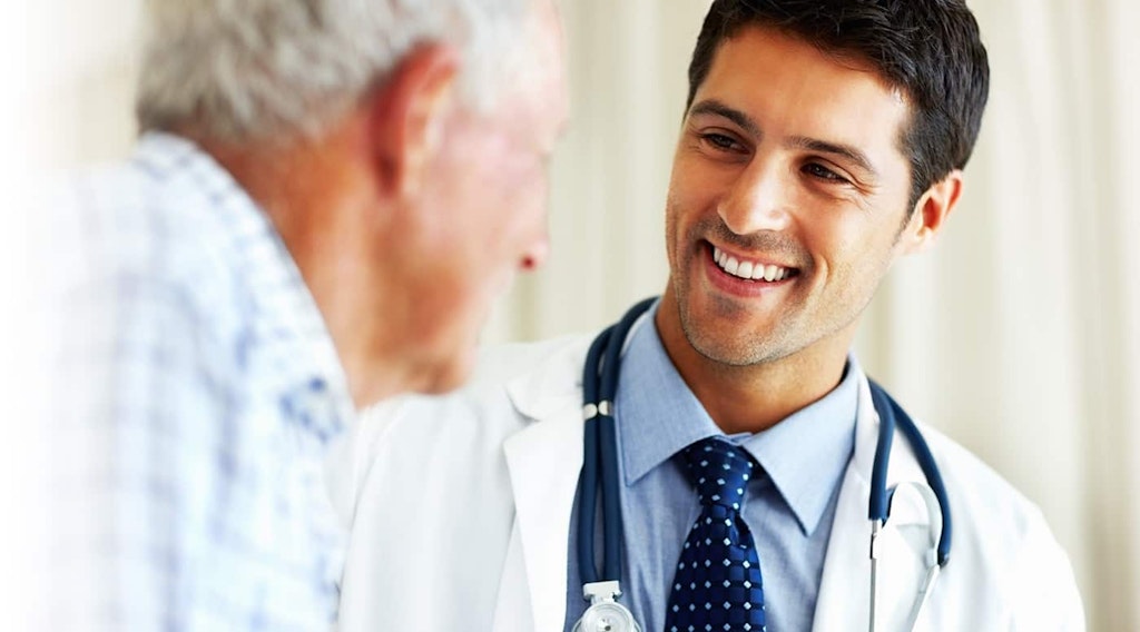 Doctor Smiling and Talking with Senior Patient