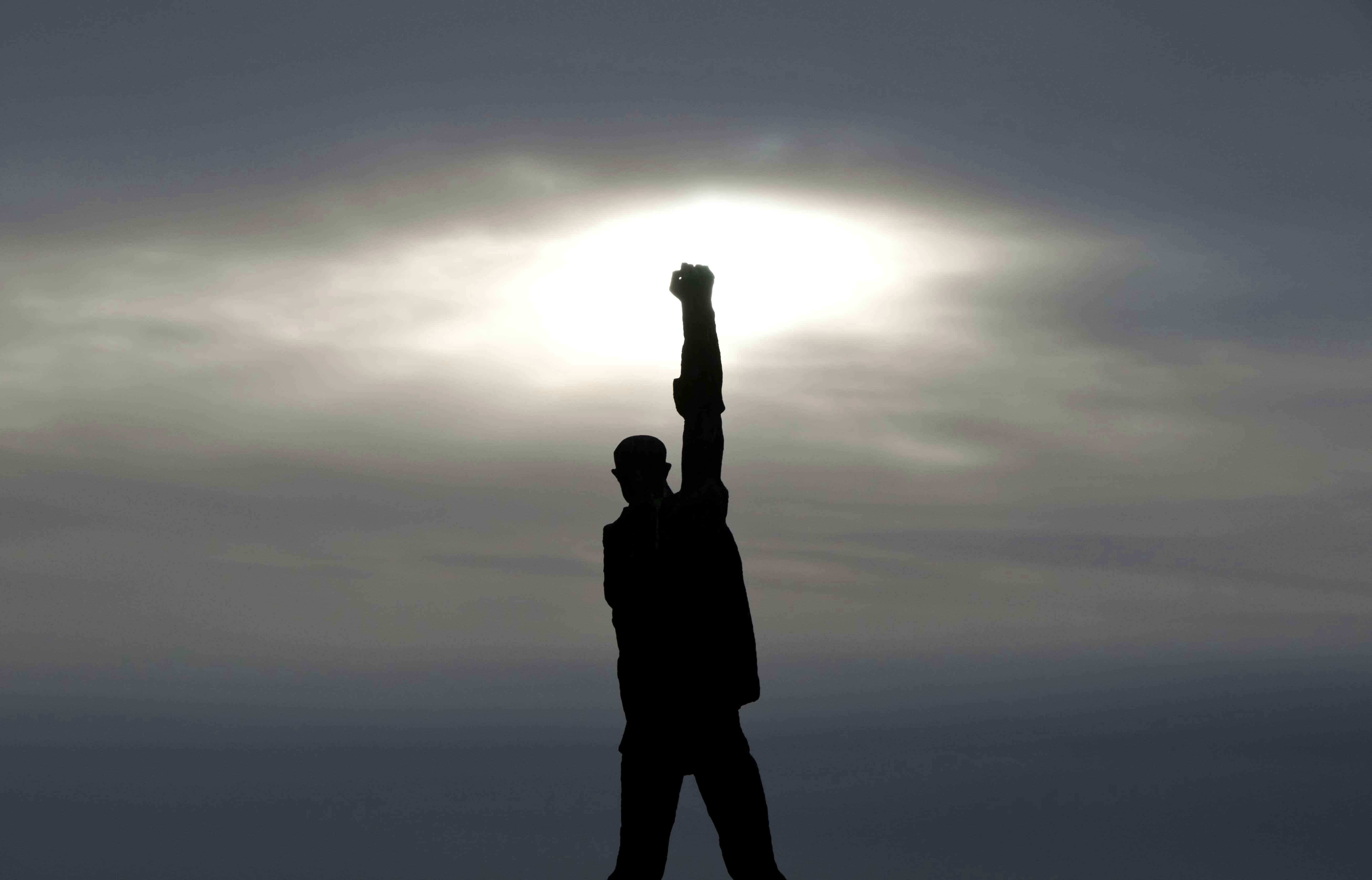 Man Triumphantly Holding a Fist in the Air