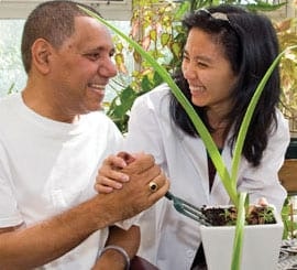 MJHS Caregiver Laughs Smiles and Assists Male Patient